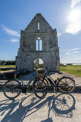 The ruin of the Xl century abbey des chateliers on the island of ile de re,france. bikes standing...