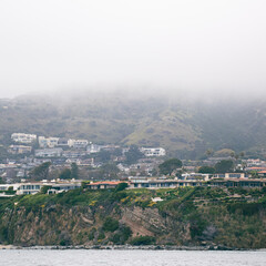 view of the ocean cliff town