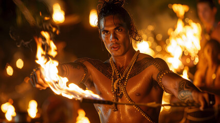 Polynesian male fire dancer at night