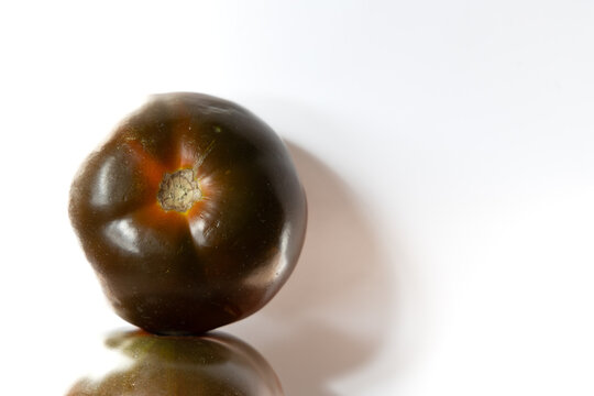 black tomato variety on a white background