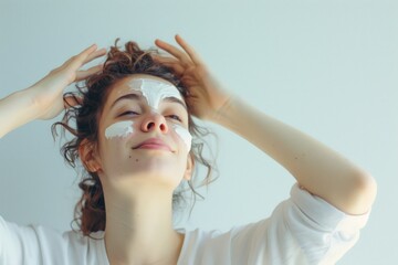 woman using face cream on white bright background