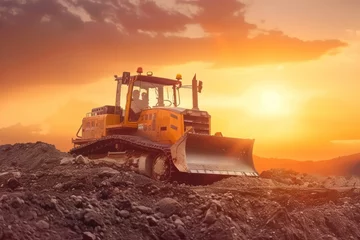 Foto op Canvas Bulldozer machine on a dirt terrain at sunset © Anna