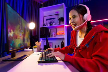 Host channel of young beautiful Asian gaming streamer playing fighting Moba at battle arena game on...