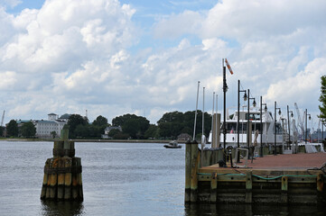 Norfolk Virginia Water Front with Pier and Ship and Boats and Forest Across the River
