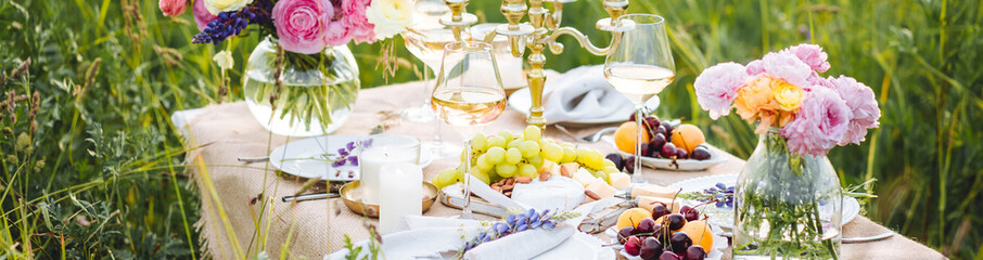 Elegant wedding or private party for a loving couple table setting outdoors in the garden....