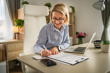 Mature woman businesswoman sign document contract at office at work