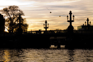 Fototapeta na wymiar Beautiful bridge on a sunset in Amsterdam