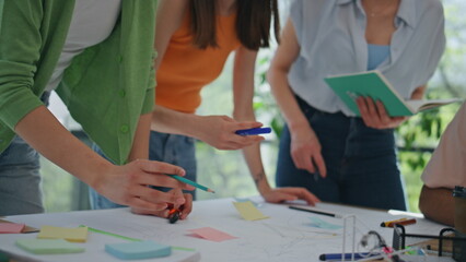 Creators hands brainstorming ideas at desk close up. Motivated coworkers working