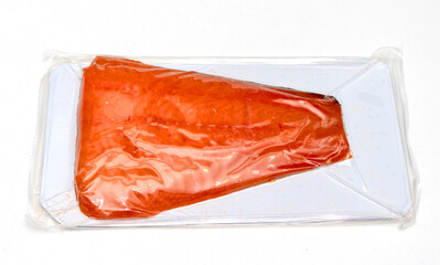 Raw cold smoked salmon packed in plastic bag sold in supermarket - 776419787