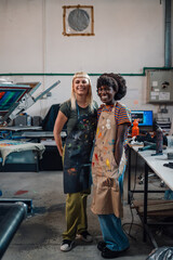 Smiling interracial printing workers standing at facility and posing.