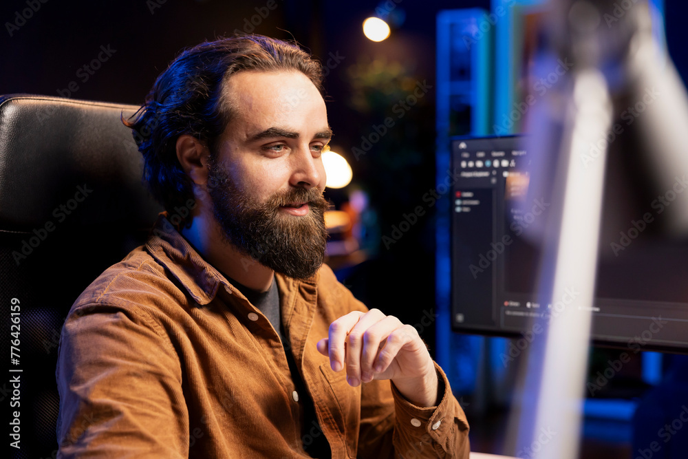 Wall mural joyful cybersecurity expert happy after finding security vulnerabilities and preventing malware infe