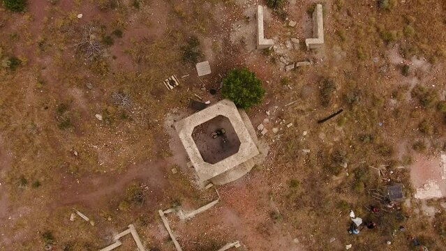 Cinematic drone shot rising above explosion in ruins