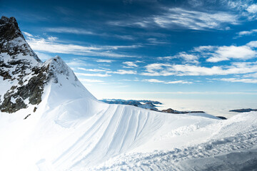 Beautiful alpine landscape with snow covered mountain peaks and blue sky in Switzerland 12-Jan-2023