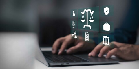 businessman working on laptop with Legal advice business concept. law icon on virtual screen.