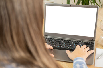 Over shoulder view girl looking at empty blank white mockup, distance learning course, using...