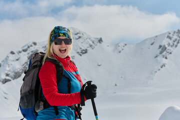 A Female Mountaineer Ascends the Alps with Backcountry Gear - 776512797
