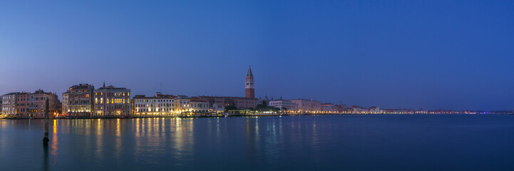 Panoramic view from sea of Piazza San Marco Campanile and Doge Palace during blue hour, Venice, Veneto, Italy