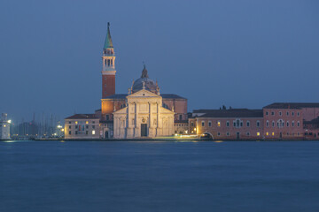 Illuminated San Giorgio Maggiore Church on a hazy winter evening during blue hour, Venice, Veneto,...
