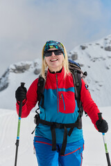 A Female Mountaineer Ascends the Alps with Backcountry Gear - 776522349