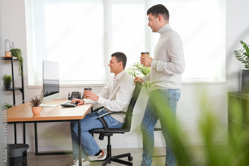 Canvas Prints young men having coffee break in office