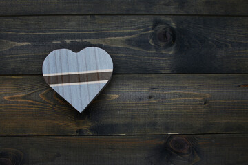 wooden heart with national flag of botswana on the wooden background.