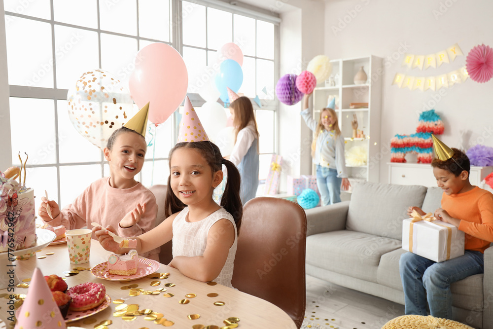 Poster Cute little girls eating Birthday cake at party