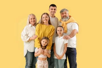 Gardinen Big family hugging on yellow background © Pixel-Shot