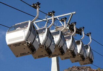 Cable car cabins in the town of Fira on the island of Santorini - obrazy, fototapety, plakaty