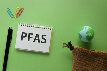 There is notebook with the word PFAS. It is an abbreviation for Per-and Polyfluoroalkyl Substances as eye-catching image. - obrazy, fototapety, plakaty