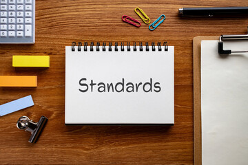There is notebook with the word Standards. It is as an eye-catching image.