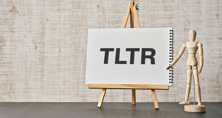There is notebook with the word TLTR. It is an abbreviation for too long to read as eye-catching...