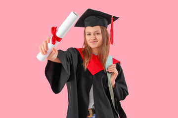Graduate female student with diploma on pink background. End of school concept