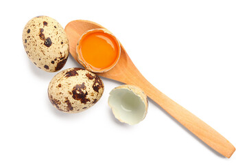 Wooden spoon with cracked fresh quail egg on white background