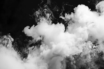 Dramatic white smoke swirling and billowing against black background, abstract photography