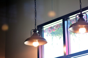 Lamps hanging from the ceiling Provides warm light in the cafe