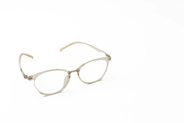Elegant eyeglasses on white background