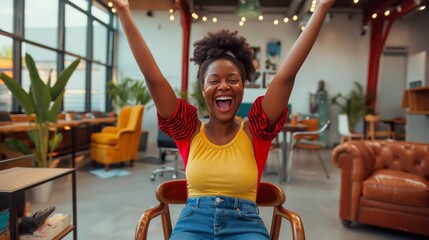 Victorious Entrepreneur, Energetic Young Woman Celebrating Success with Raised Arms, Seated in Office Chair.