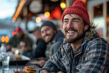 Smiling man with a beanie and beard enjoying time in a cozy diner setting. a truck driver sharing a meal with fellow drivers at a roadside diner, capturing the camaraderie of life on the road