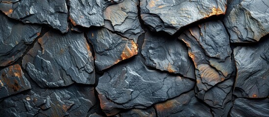 A close up of a rock wall with a black background