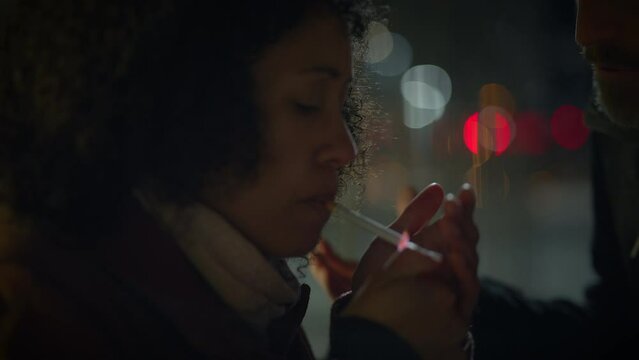 Woman with Curly Hair Smoking Cigarette While Arguing with Upset Husband