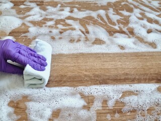 Washing the floor with a disinfectant solution