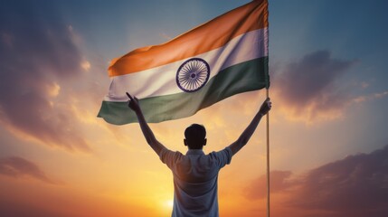 Happy man holding Indian flag in the sunset sky freedom and patriotism concept