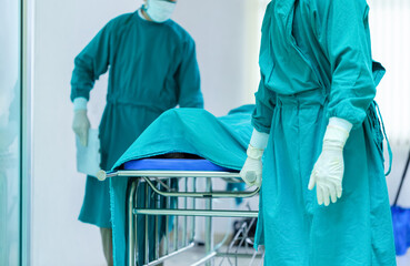 Medical team moving a patient to surgery in the operating room at the hospital