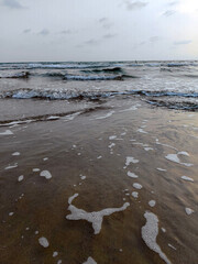 waves on the beach in sunny day