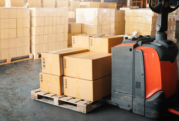 Package Boxes on Pallets and Forklift Pallet Jack. Cardboard Boxes, Warehouse Shipping, Distribution Storehouse, Shipment Boxes, Supply Chain, Supplies Warehouse Shipping Logistics.
