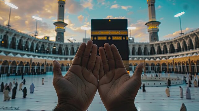 Devout Muslim praying with open hands facing the Kaaba during a serene sunset at the Grand Mosque.