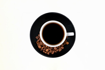 A steaming cup of freshly brewed coffee sits elegantly atop a pristine white plate, exuding warmth and inviting aroma.