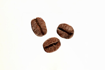 White Background Coffee Beans: A close-up of roasted coffee beans isolated on a white background