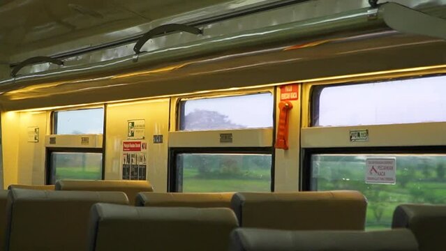 Public trains in Java, Indonesia are empty of passengers when it is almost dark. There were many empty seats on the intercity train and the carriages looked deserted