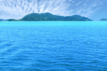 Blue sea wave background with island